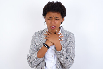 African American businesswoman with curly bushy hair wears  formal clothes over white background...