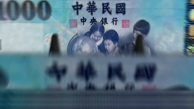 Money counting machine with Taiwan dollar banknotes. Business, economy, banking and finance in Republic of China. Abstract concept loopable and seamless animation. Fast TWD currency rotation.