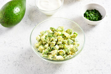 Avocado eggs salad in bowl