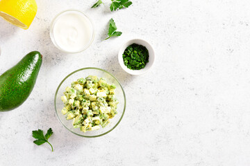 Avocado eggs salad in bowl