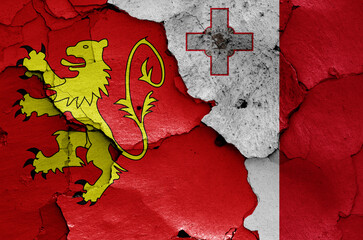 flags of Valletta and Malta painted on cracked wall