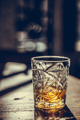 Whisky glass on a wooden surface