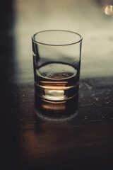 Whisky glass on a wooden surface