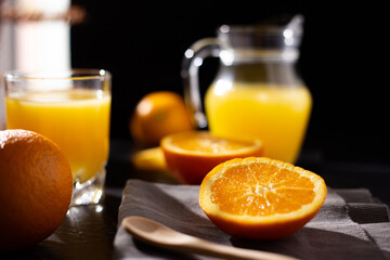 table full of fresh oranges and juice in springtime