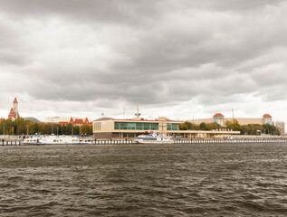 Moscow, Russia, Sep 14, 2019: Motor ship sails on the  Moscow river. Southern river station. Pre-storm weather. Dark clouds