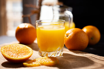table full of fresh oranges and juice in springtime