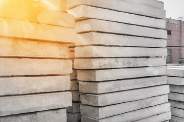 Storage of concrete blocks in a warehouse. Concrete structures at the construction site. Industrial, building cement materials