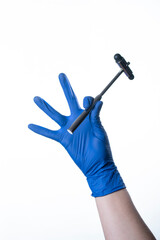 doctor wearing blue gloves holding reflex hammer