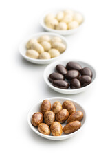 Sweet chocolate almonds. Chocolate eggs in bowl.