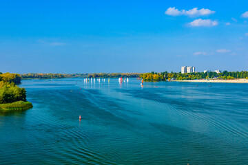 Many yachts at the river Dnieper on autumn in Kremenchug, Ukraine. Sailing regatta