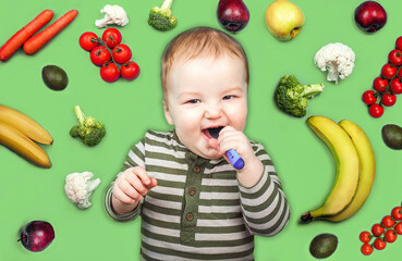 Fototapeta na wymiar toddler with spoon on green background surrounded by fruits and vegetables. Complementary feeding of children, food allergies.