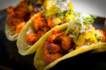 Pork tacos with mango and onion