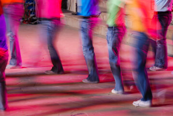 Obraz premium Unrecognised group of people dancing on a stage. Blurred motion of dancers