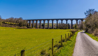 A view towards the Victorian railway viaduct at Cynghordy, Carmarthenshire, South Wales on a sunny day