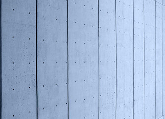 abstract perspective view of a blue toned concrete surface with a pattern of dots and vertical lines