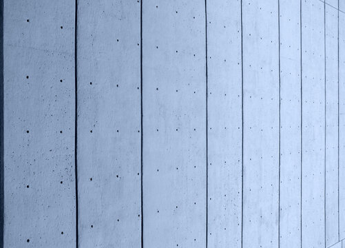 abstract perspective view of a blue toned concrete surface with a pattern of dots and vertical lines