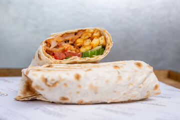 doner in pita bread with chicken and vegetables in a cut
