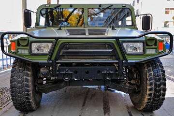 Chinese green off-road vehicle in a street of downtown Zhangye-Gansu-China-1292