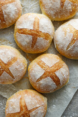 Homemade freshly baked bread rolls, top view. Delicious breakfast bread