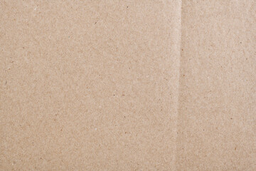 Texture of old organic cardboard, beige paper, background for design, copy space. Recyclable material, has inclusions of cellulose