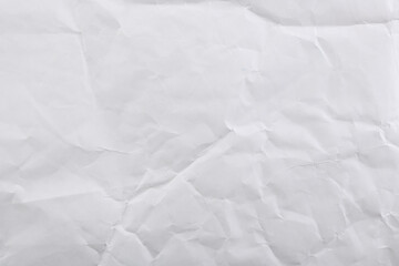 Crumpled wrinkled white paper background, wrinkled writing paper texture.
