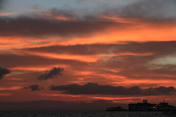 sunset over sea in partly cloudy