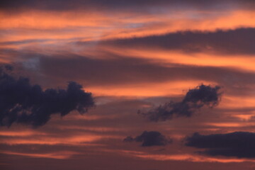 sunset over sea in partly cloudy