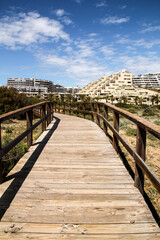 Obraz premium Wooden walkway to the beach in the morning in Spain