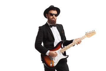Bearded male guitarist in a suit