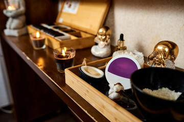 decor with candles figurines of buda in the massage room of the spa salon