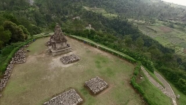 Isolated Hindu Temple aerial footage landscape view with green trees background