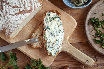 Herbal butter made from young nettles on a slice of bread
