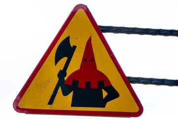 Humorous road sign showing executioner warning - obrazy, fototapety, plakaty