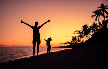 Happy mother and child together on the beach. 