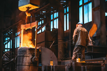 Metallurgist control casting metal in foundry workshop factory.