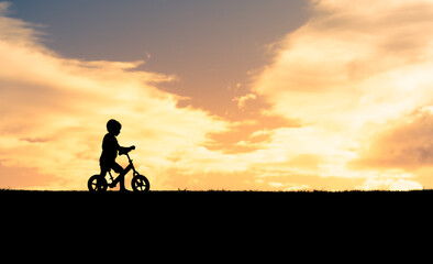 little boy riding his bicycle 