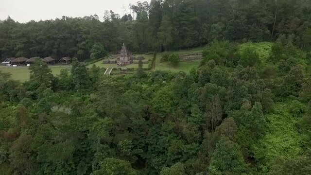 Isolated Hindu temple aerial view in the green forest