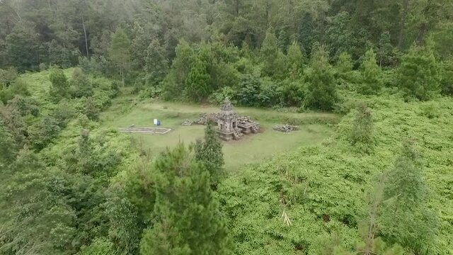 Small Hindu temple aerial view in Bandungan, Central Java, Indonesia. Taken from drone flying sideway