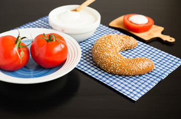 Breakfast. Grain Bagel with Tomatoes and Cream Cheese