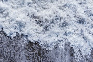 Wave of the sea water at sunny day time.