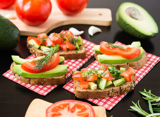 Healthy food. Vegan food. Vegetable appetizers. Sandwich : Rye Bread, Avocado, Tomatoes, Dill.