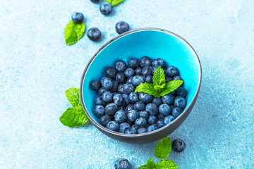 Ripe, sweet blueberries bowl table for healthy nutrition