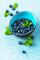 Ripe, sweet blueberries bowl table for healthy nutrition