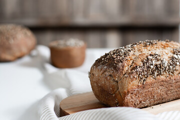 Whole grain homemade bread with seeds. Copy space. Selective focus