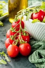 Gordijnen close-up view of fresh salad with tomatoes and arugula on table © karepa