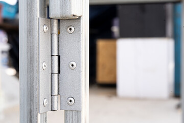 Stainless steel hinge, installed on the pipe by rivet.