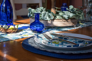 Pretty spring table setting with cobalt glass accents