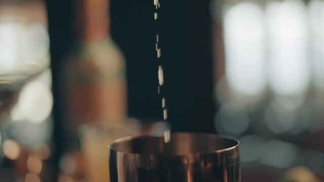 Lemon Juice Drops Coming Out From Squeezer Into Cocktail Shaker, Close Up, Slow Motion