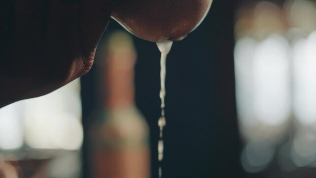 Drops of Lemon or Lime Juice Coming OUt From Squeezer, Close Up Slow Motion