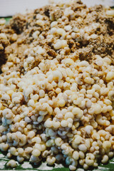 Red ant egg on banana leaf
